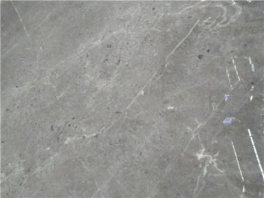 بلاطة من الرخام البني الداكن